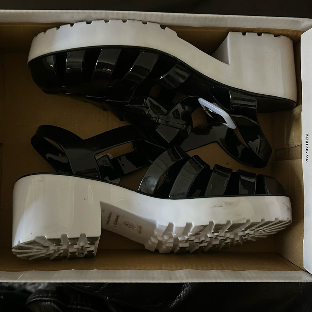 Like new plastic shoes. They are a size 5 and have only been worn once.